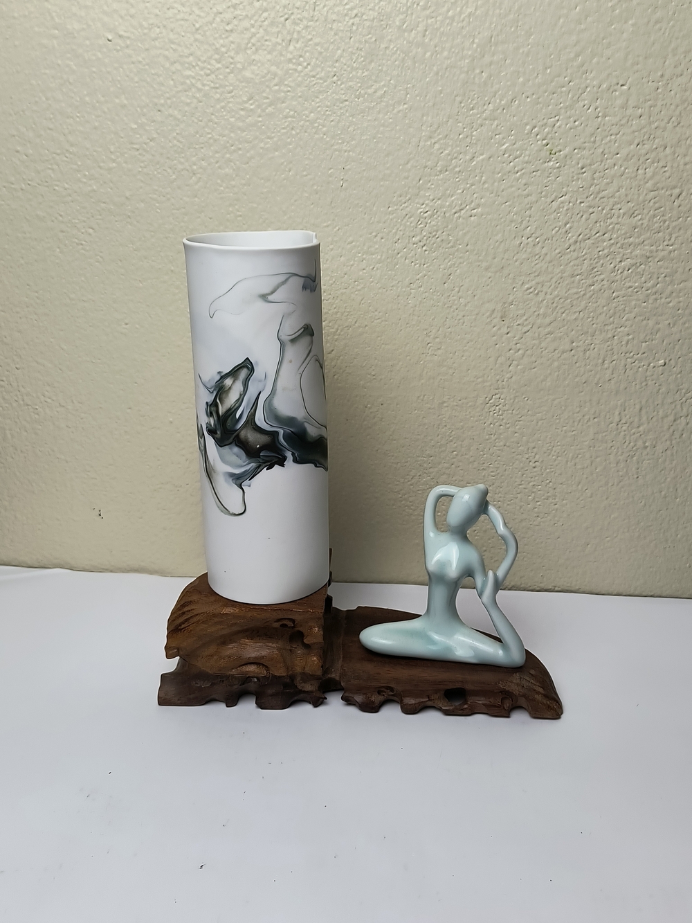 Elegant White Marble-Pattern Vase with Light Blue Figurine Graceful Yoga Wood